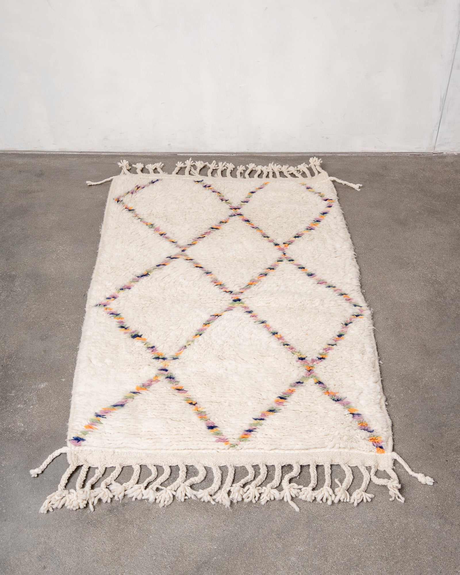 Modern, designer, handcrafted Berber rug from Morocco. Beniourain carpet with beautiful colours and patterns and fluffy wool texture.